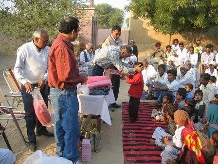 Volunteers meet villagers at 74 N.P., December 2006