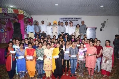 Sponsored students, families and guests together on stage at the 2019 scholarship day